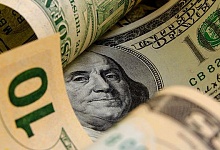 Курс доллара к рублю на Московской бирже опустился ниже 59 руб. впервые с 10 ноября